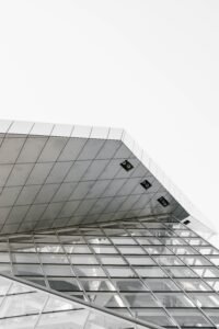vertical grey scale shot of a geometrical structure captured from a low angle